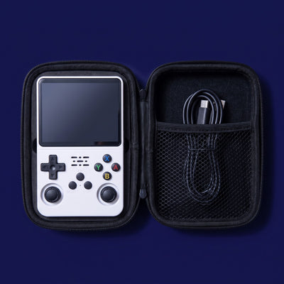 The Turn One handheld nested in its open black hard-shell carry case, with a USB-C cable in the mesh pocket