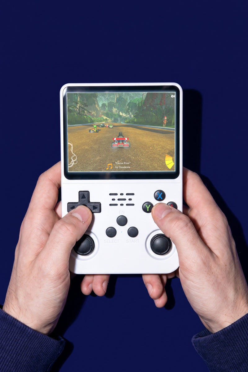 Turn One held in two hands, thumbs on the controls